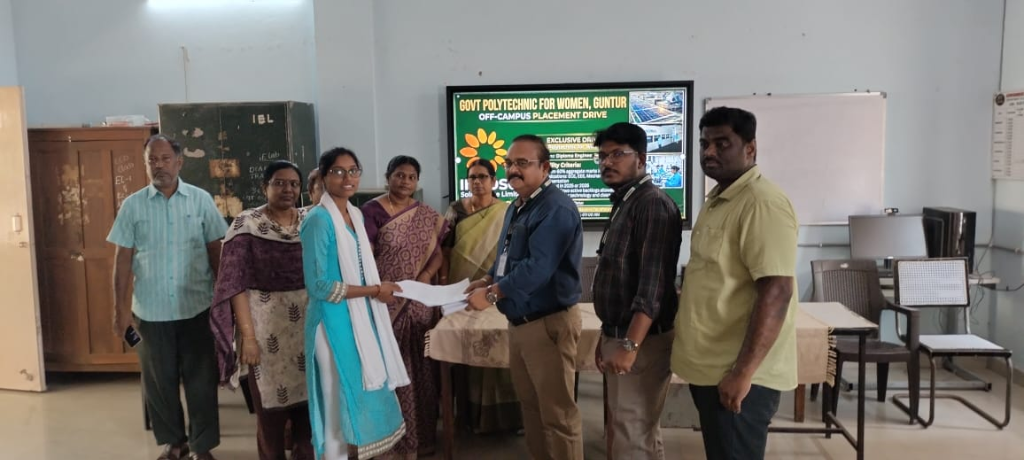 Students receiving appointment letters from Indosol Solar Pvt Ltd officials